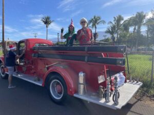 Maui Santa Elf 1944 vintage fire truck parade