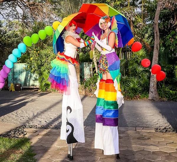 rainbow stilt walkers